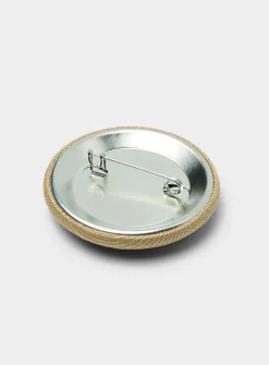A embroidered badge pin