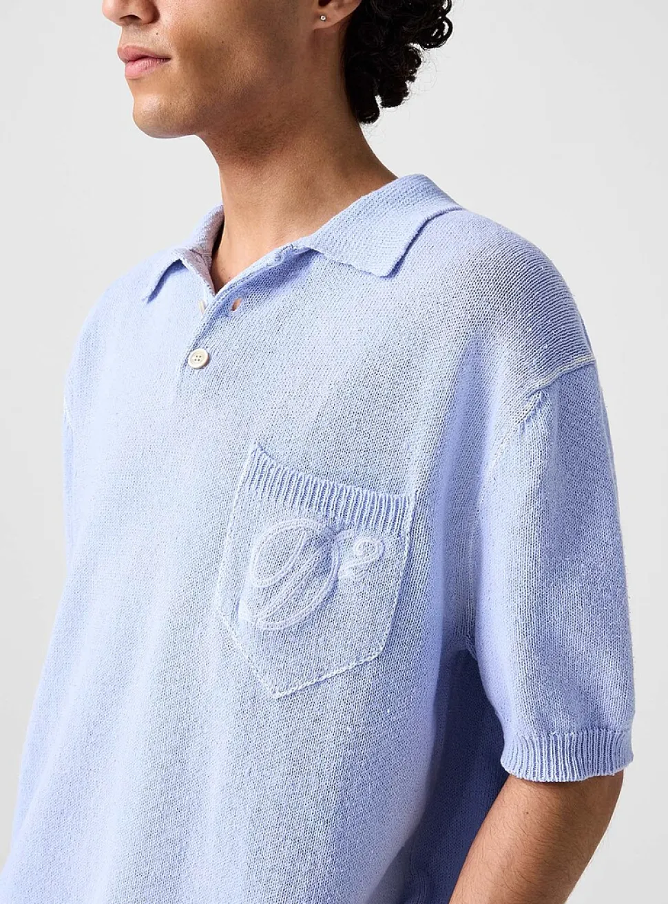 Cursive logo knit polo