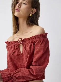 Ruffled off-the-shoulder blouse