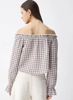 Ruffled off-the-shoulder blouse