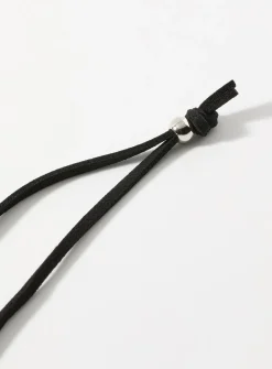 Sinuous hammered medallion cord necklace
