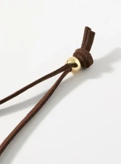 Sinuous hammered medallion cord necklace
