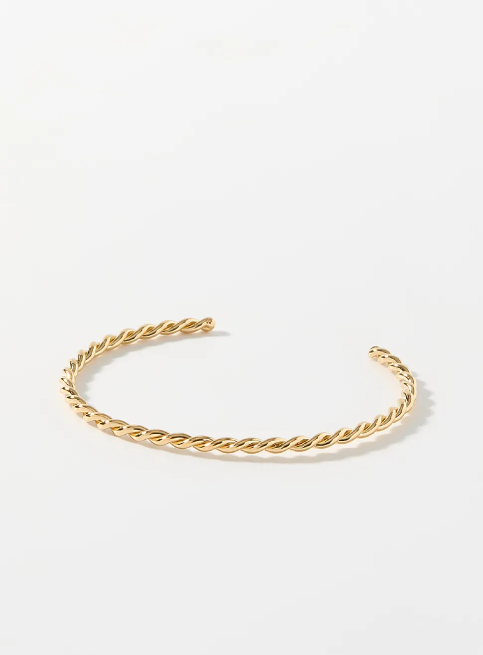 Twisted openwork golden bracelet