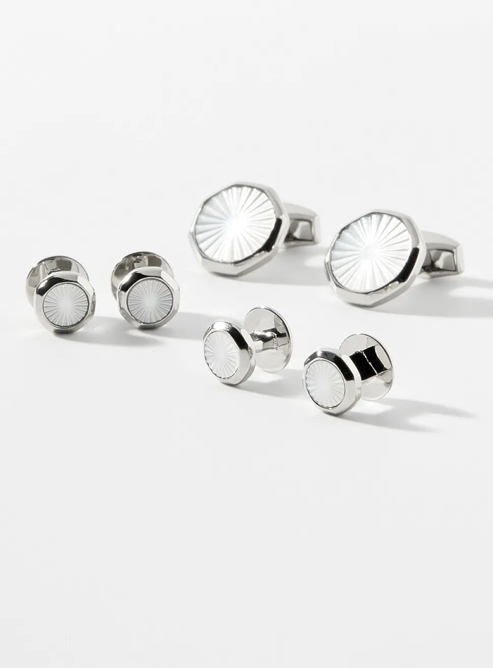 White mother-of-pearl cuff links and shirt buttons