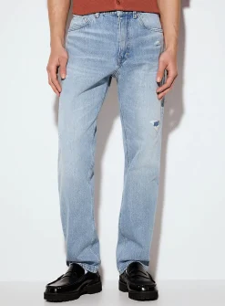 Worn faded blue jean
